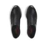 Laurel slip-on athleisure in black kid leather and black suede trim and color matched wide band gore on vamp with white outsole-top view