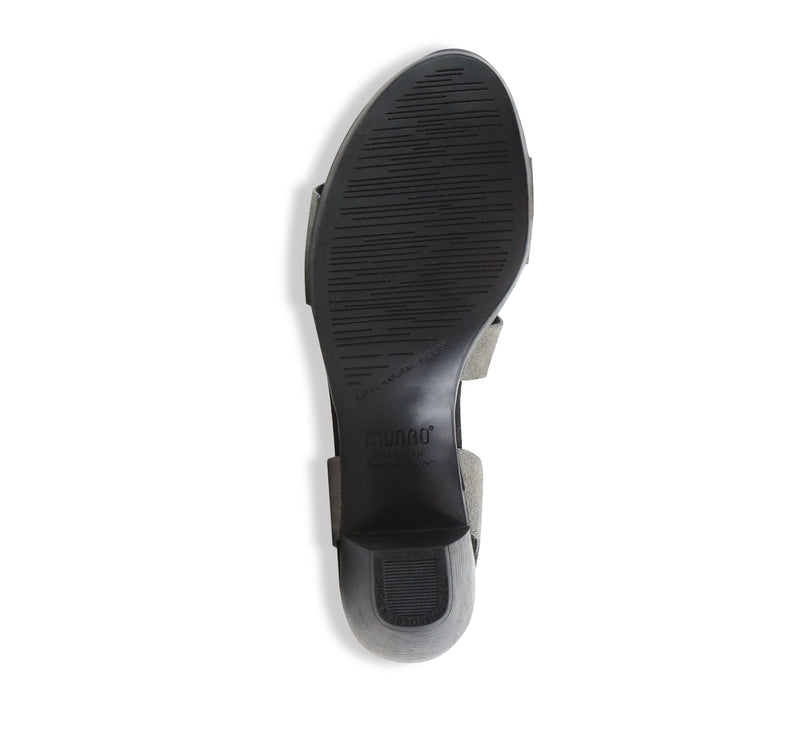 Lucia dress sandal with a single-band vamp strap and an asymmetrical hook & loop instep strap in gunmetal suede - bottom view