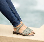 HAVEN LOW HEEL STRAPPY SANDAL IN GREEN NUBUCK - ON MODEL