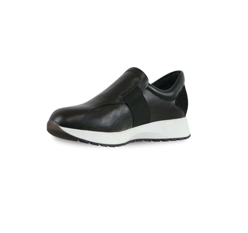 Laurel slip-on athleisure in black kid leather and black suede trim and color matched wide band gore on vamp with white outsole-inside view