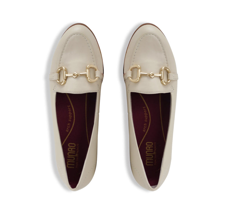 Tanya loafer in cream lamb leather with saddle bit, apron vamp, and latex rubber outsole-top view