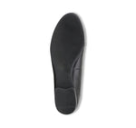 Tanya loafer in black lamb leather with saddle bit, apron vamp, and latex rubber outsole-bottom view