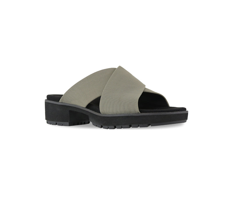 Dekkie slide sandal with wide khaki fabric bands crisscross the instep to support and comfort your feet-angle view