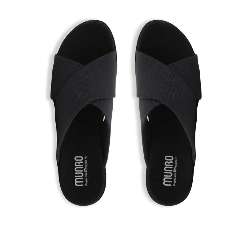 Dekkie slide sandal with wide black fabric bands crisscross the instep to support and comfort your feet-top view