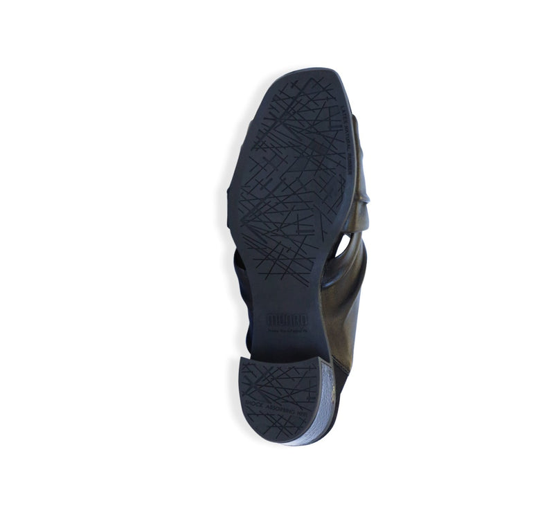 Lee ruched cross-band slide sandal on mid-height Leawood stacked heel in black ultra-supple lamb leather-bottom view