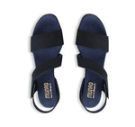 Lucia dress sandal with a single-band vamp strap and an asymmetrical hook & loop instep strap in navy leather-top view