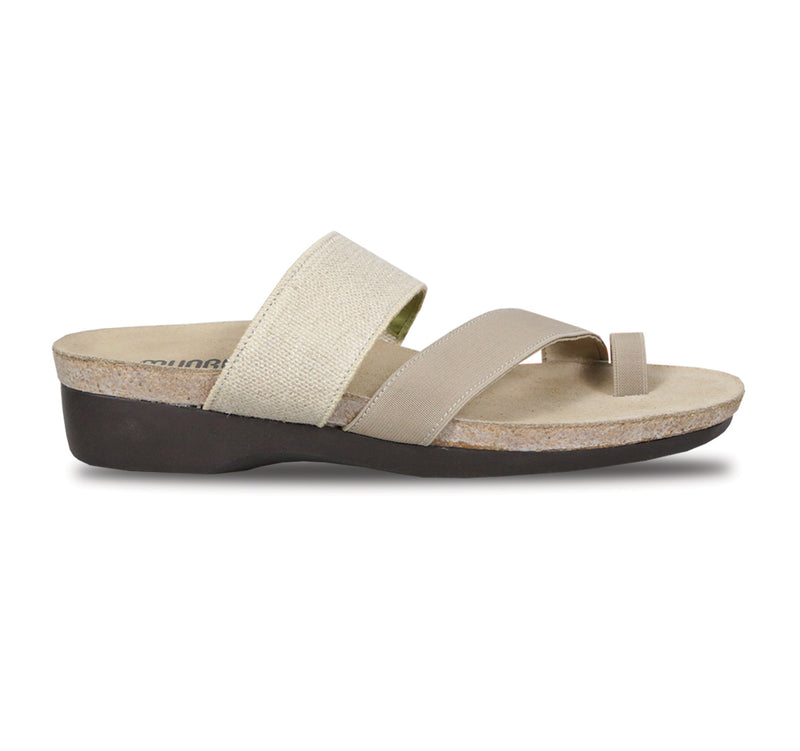 Aries toe-ring footbed slide sandal with asymmetrical vamp strap and wide band instep strap in natural color stretch fabric-side view