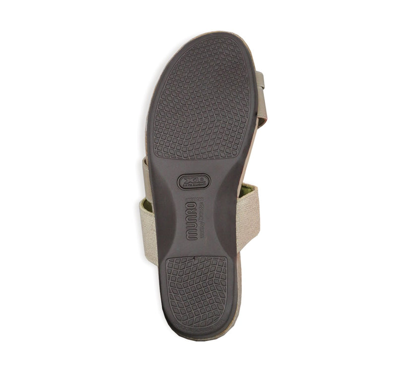 Aries toe-ring footbed slide sandal with asymmetrical vamp strap and wide band instep strap in natural color stretch fabric-bottom view