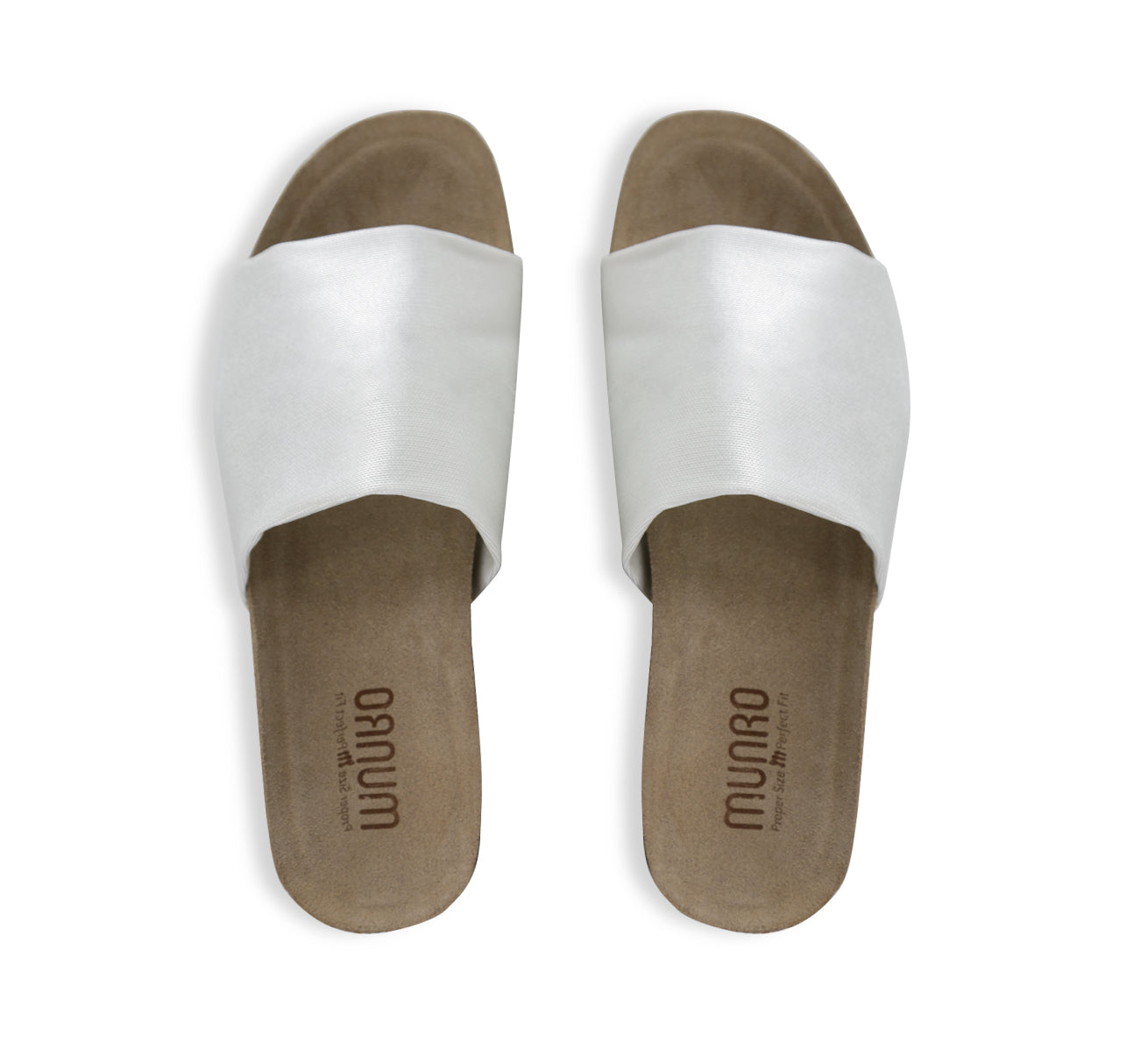 Casita single strap footbed slide sandal on low-wedge outsole in silvery metallic color stretch fabric-top view