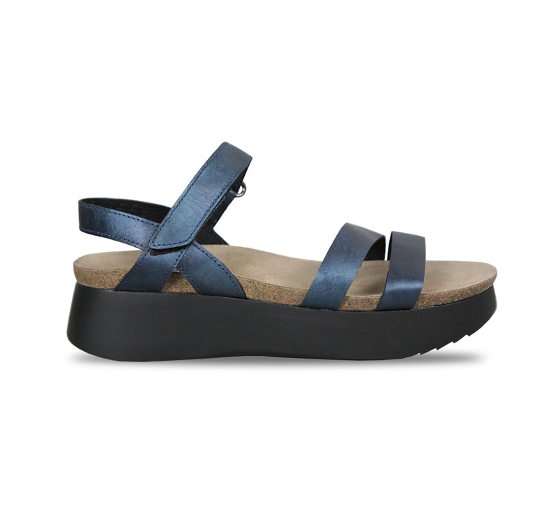 Juniper strappy suede covered cork footbed sandal on platform wedge in blue metallic leather-side view